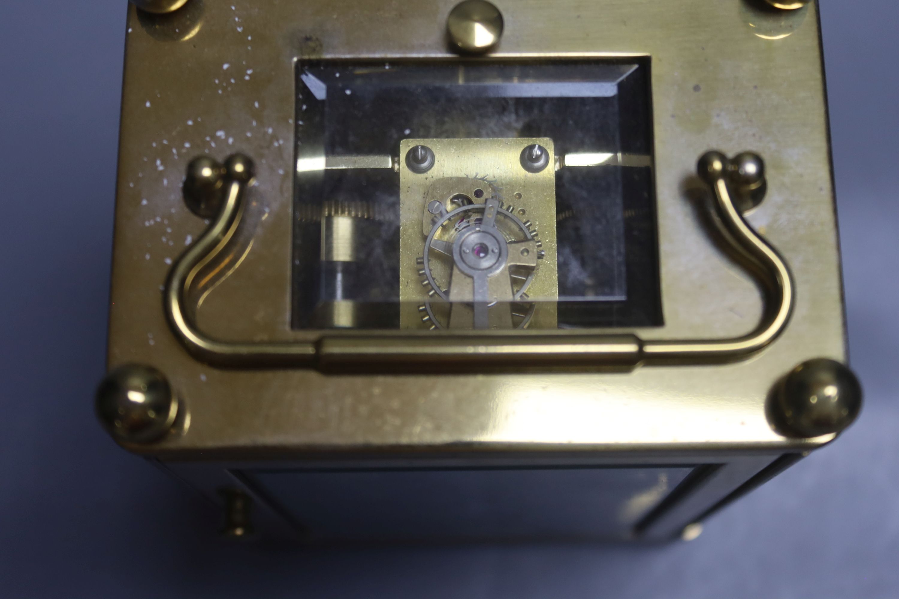 A Charles Frodsham brass cased repeating carriage clock, height 14cm with handle down